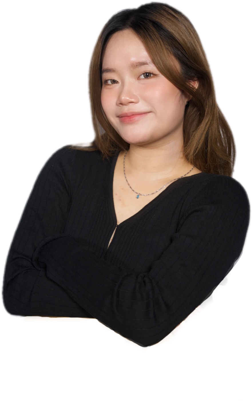 Portrait of Vicky He, smiling with arms crossed